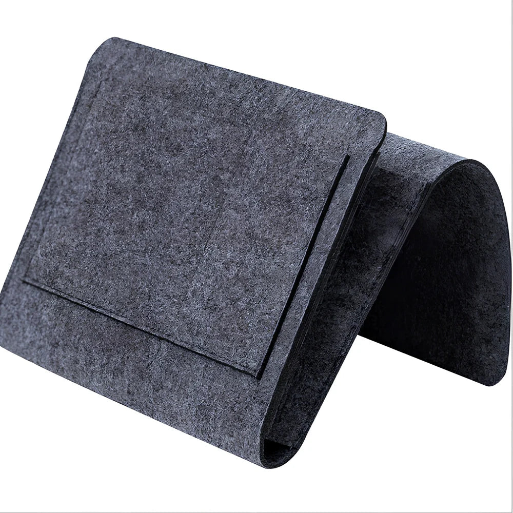 Felt bedside storage bag measuring 30x20x10cm with multiple pockets for remote controls and books