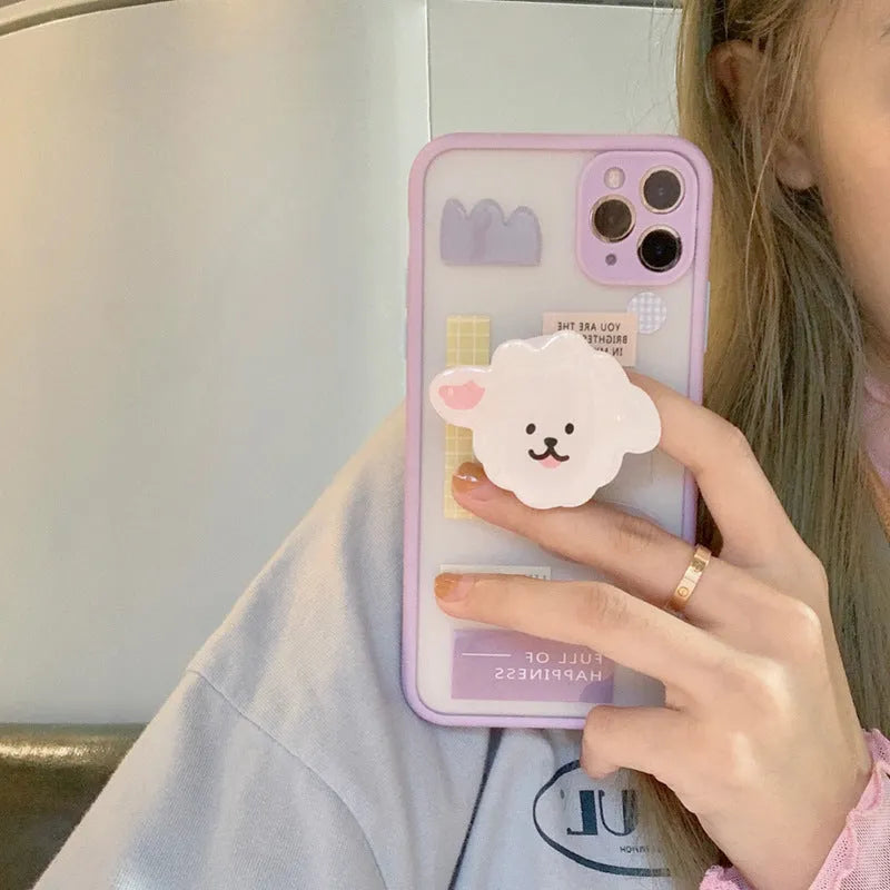 Frosted TPU mobile phone case with integrated stand bracket for Apple iPhone, showing cartoon design options.