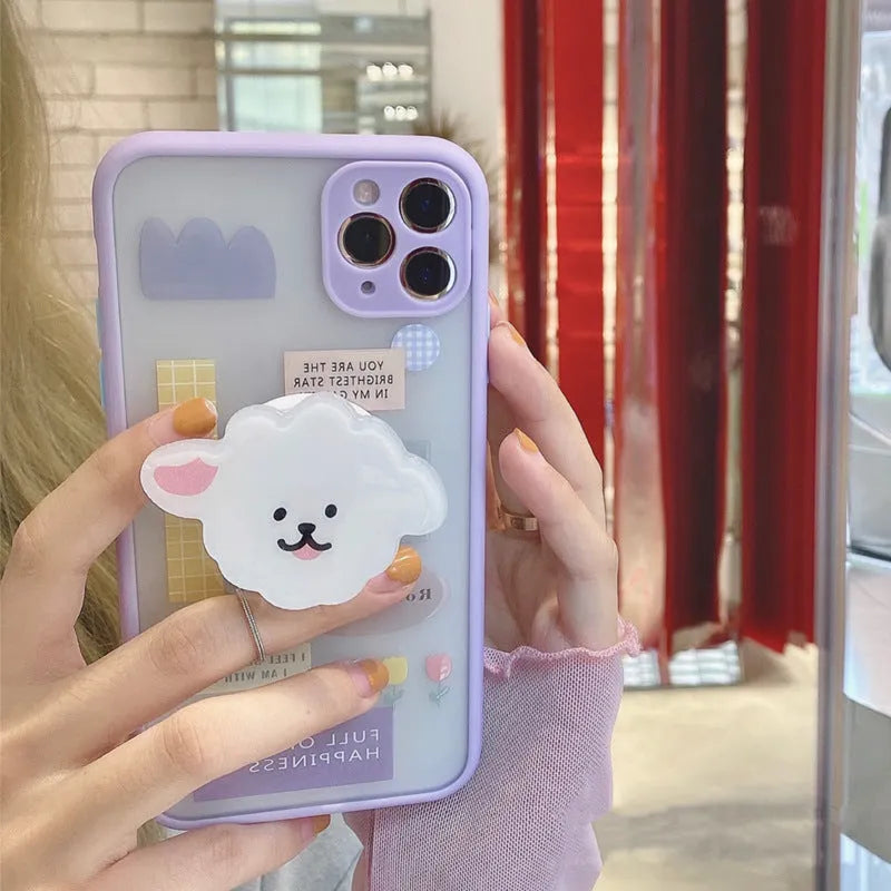 Frosted TPU mobile phone case with integrated stand bracket for Apple iPhone, showing cartoon design options.