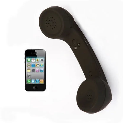 Retro-style Bluetooth wireless headset in hand, showing classic phone handset design and ear hook.