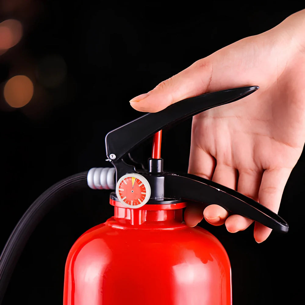 Red fire extinguisher-shaped beverage dispenser with hand-press mechanism and pouring hose