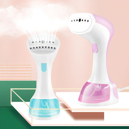 Pink and green portable garment steamer with brush attachment and 0.9-1.3L water tank capacity