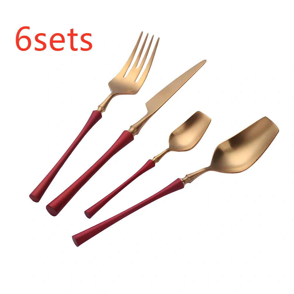 Four-piece stainless steel cutlery set showing main knife, fork, spoon, and teaspoon with mirror finish