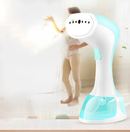 Pink and green portable garment steamer with brush attachment and 0.9-1.3L water tank capacity
