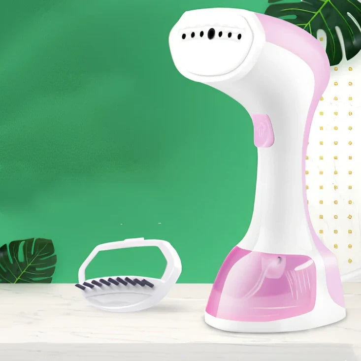 Pink and green portable garment steamer with brush attachment and 0.9-1.3L water tank capacity