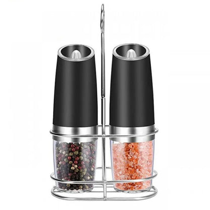 Modern electric gravity pepper grinder in matte black with adjustable ceramic mill and blue LED light on.