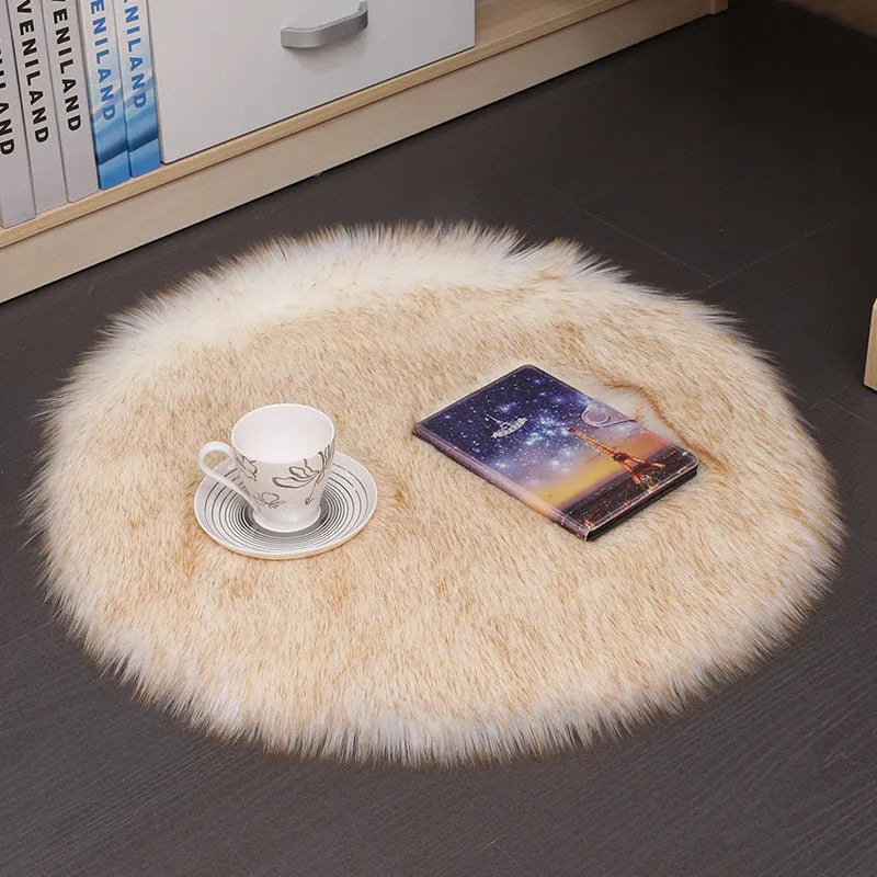 Round plush wool carpet in beige colour on a wooden floor.