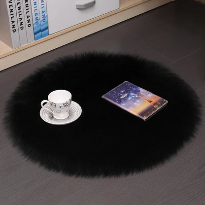 Round plush wool carpet in beige colour on a wooden floor.