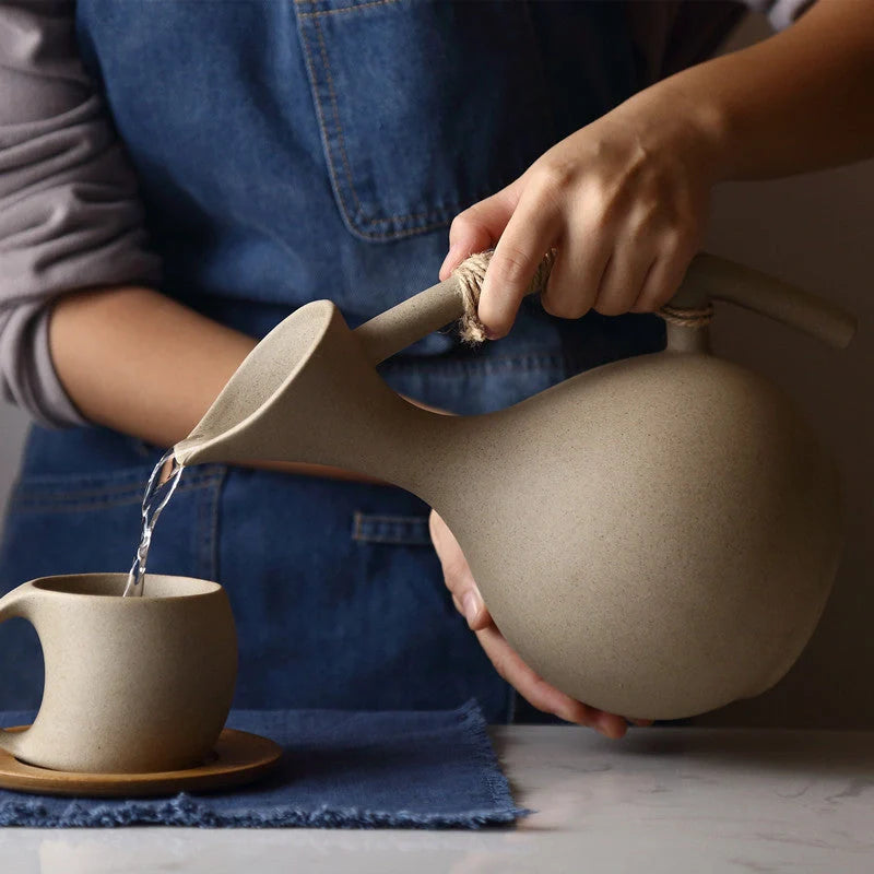 Elegant Ceramic Cold Brew Kettle Set with matching cups on bamboo tray