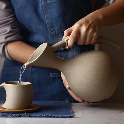 Elegant Ceramic Cold Brew Kettle Set with matching cups on bamboo tray