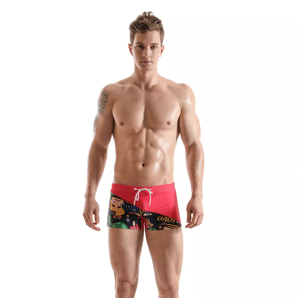 Men's cartoon print boxer shorts in pink, yellow, and black with moisture-wicking fabric