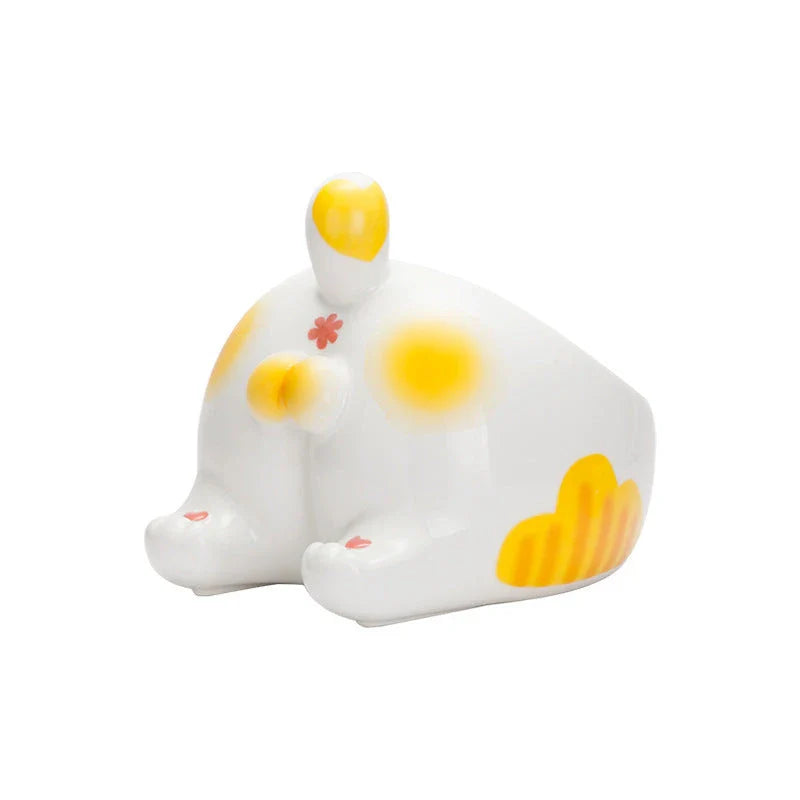 Stylish ceramic pet bowls in various cat-inspired designs, featuring inclined mouths for comfortable eating and large capacities for food and water.