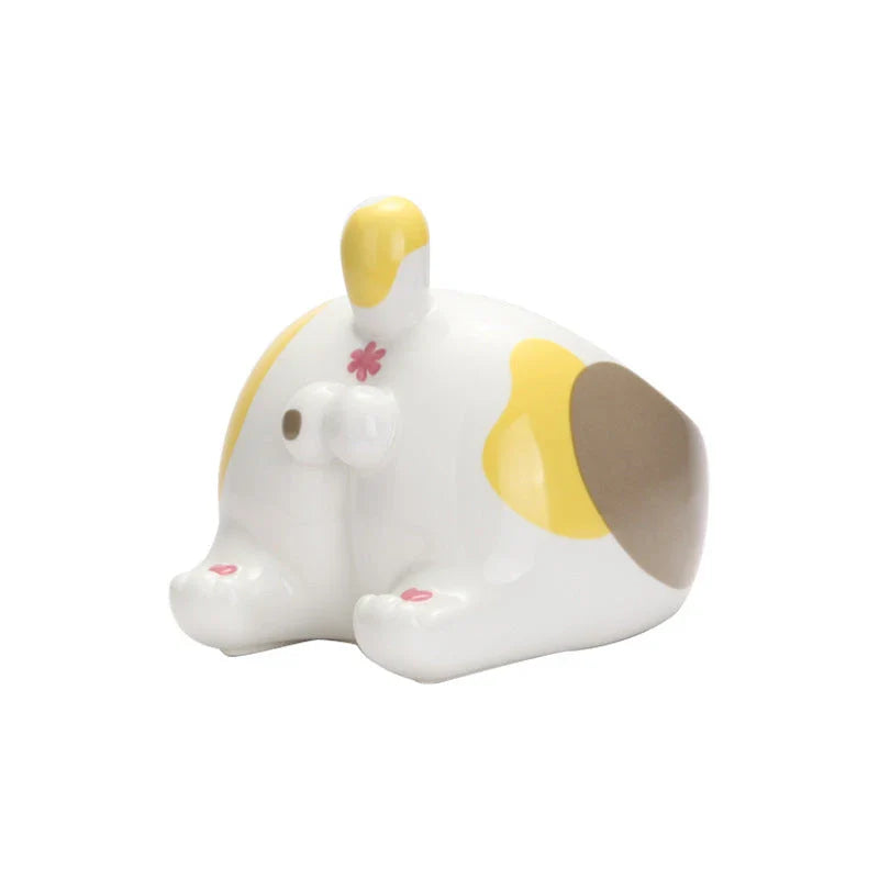 Stylish ceramic pet bowls in various cat-inspired designs, featuring inclined mouths for comfortable eating and large capacities for food and water.
