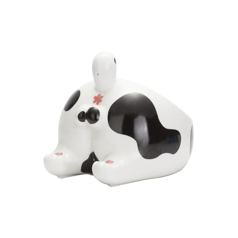 Stylish ceramic pet bowls in various cat-inspired designs, featuring inclined mouths for comfortable eating and large capacities for food and water.