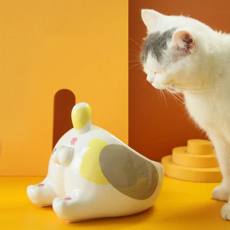 Stylish ceramic pet bowls in various cat-inspired designs, featuring inclined mouths for comfortable eating and large capacities for food and water.