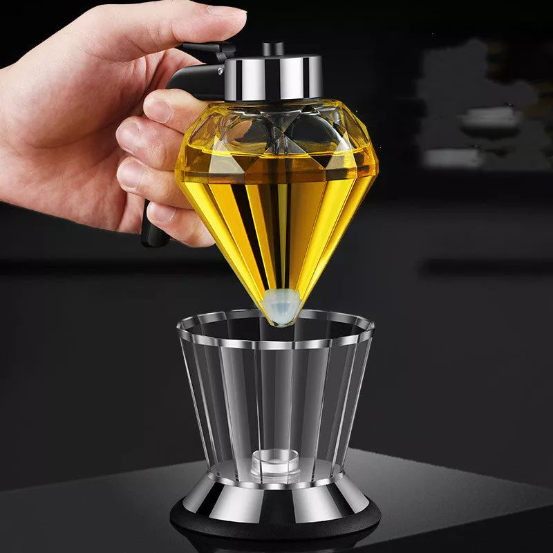 Diamond-shaped glass oil jug with press-type dispenser for drip-free pouring