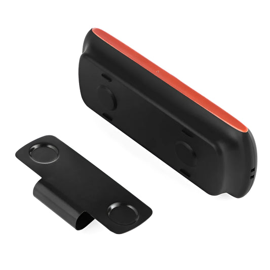 Orange Bluetooth car hands-free speaker mounted on vehicle sun visor for wireless phone calls and music
