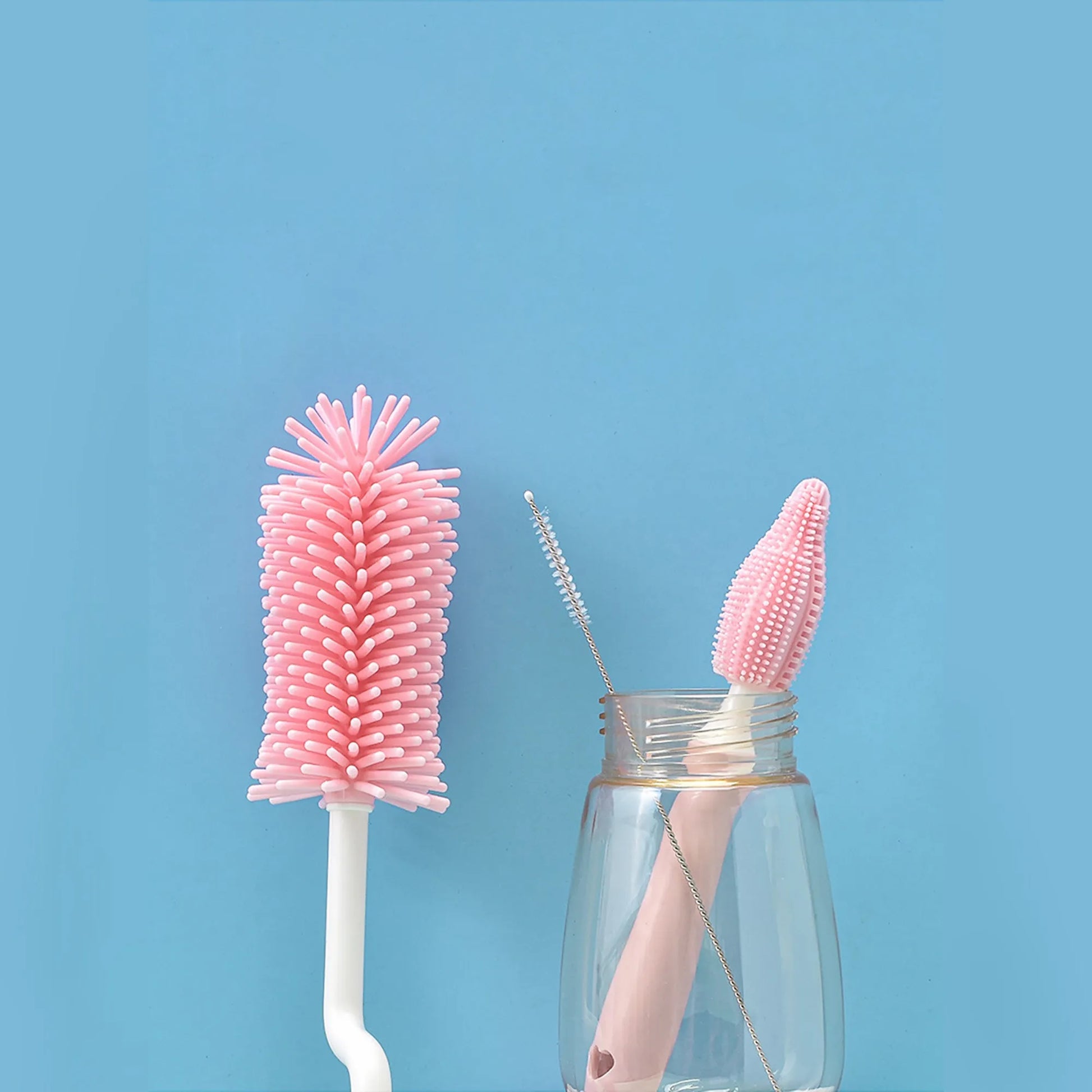 Silicone baby bottle brush with flexible handle and straw cleaning attachment in multiple colour options