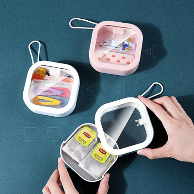Portable push-button storage box in white color, featuring a sleek and modern design for desk or travel organization