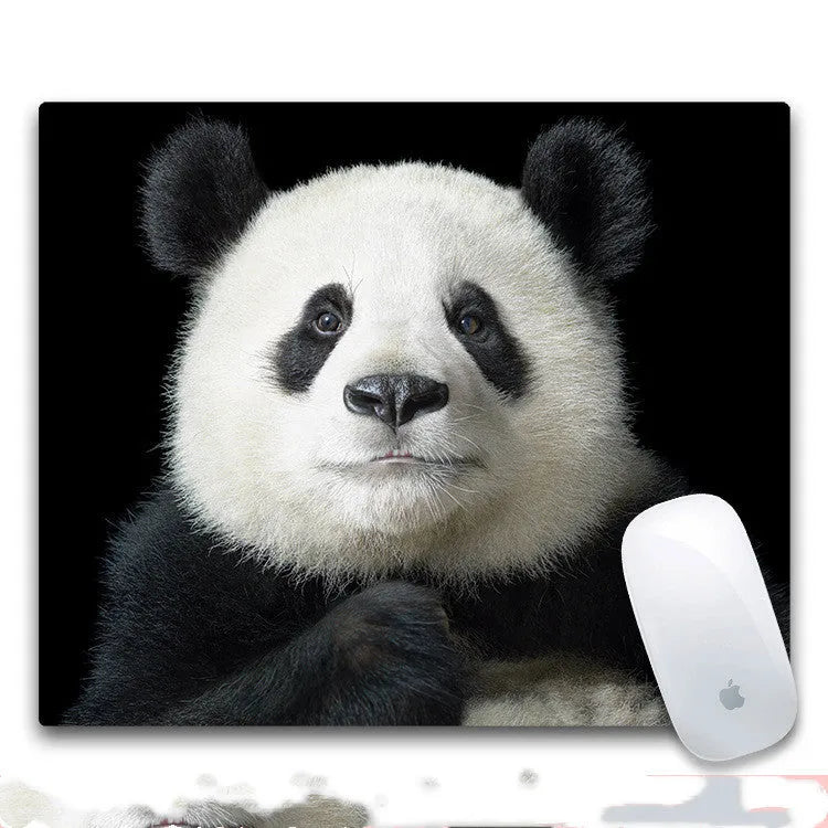 Custom mouse pad with selected graphic on fabric surface and non-slip rubber base.