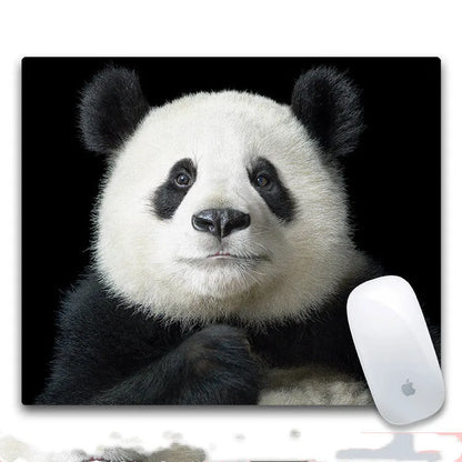 Custom mouse pad with selected graphic on fabric surface and non-slip rubber base.