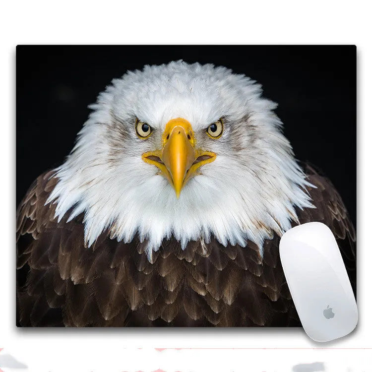Custom mouse pad with selected graphic on fabric surface and non-slip rubber base.
