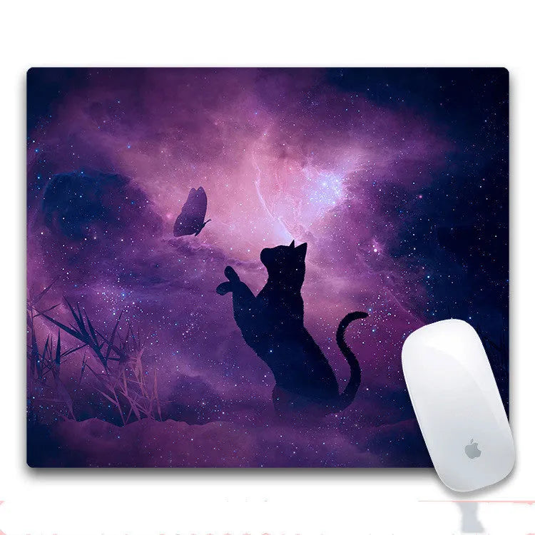 Custom mouse pad with selected graphic on fabric surface and non-slip rubber base.