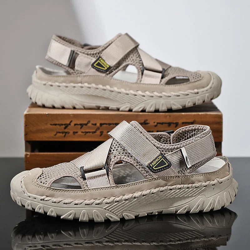 Men's grey casual sandals with hollow mesh upper, elastic band, and rubber sole.