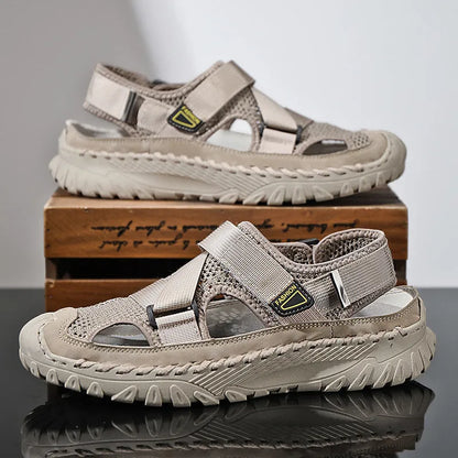 Men's grey casual sandals with hollow mesh upper, elastic band, and rubber sole.