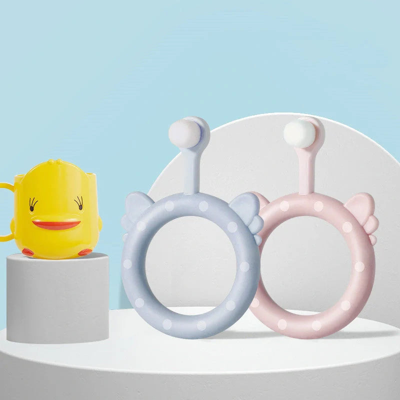 Infant children's soft silicone toothbrush set in blue, pink, and green for safe gum care