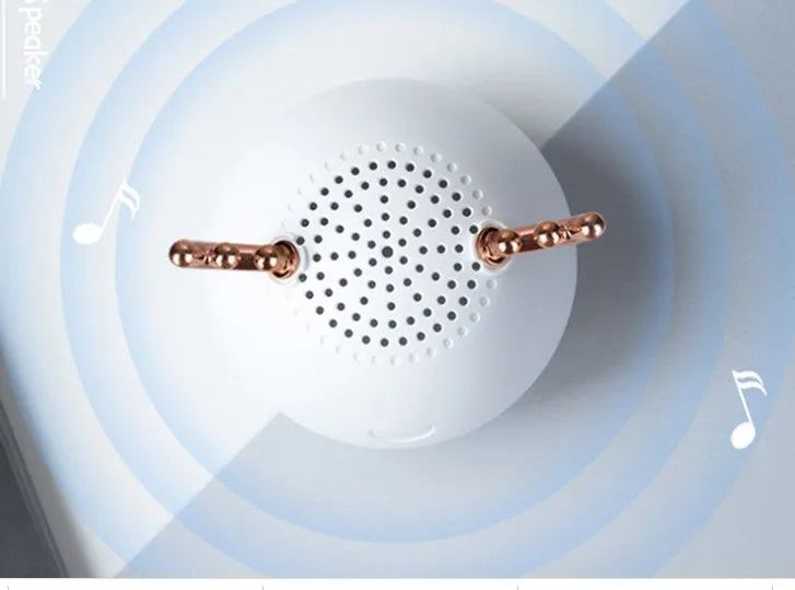 Small white, pink, or green portable Bluetooth speaker with USB cable.