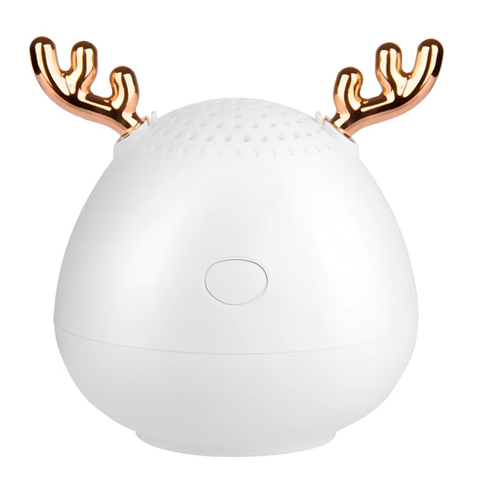 Small white, pink, or green portable Bluetooth speaker with USB cable.