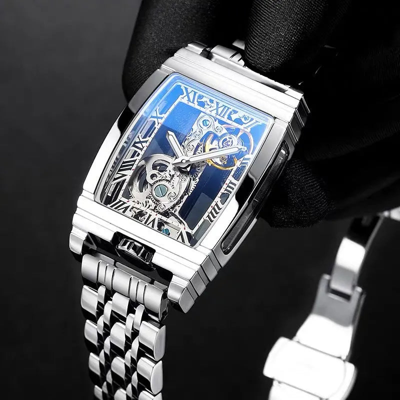 Daystar square stainless steel mechanical watch with leather strap on wrist, showing white dial and case.