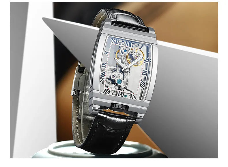 Daystar square stainless steel mechanical watch with leather strap on wrist, showing white dial and case.