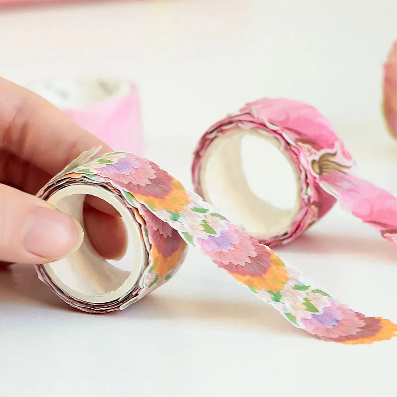 Roll of clover and paper decorative craft tape in blue, cherry blossom, mixed colour, and violet options.
