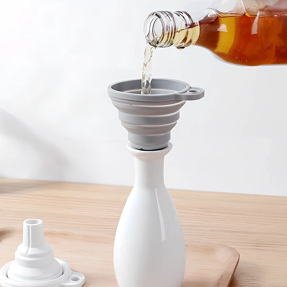 Grey silicone folding funnel collapsed to 2.5cm thickness beside expanded 18cm diameter version