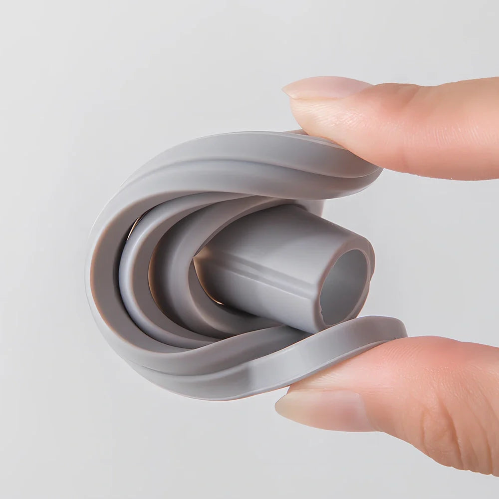 Grey silicone folding funnel collapsed to 2.5cm thickness beside expanded 18cm diameter version