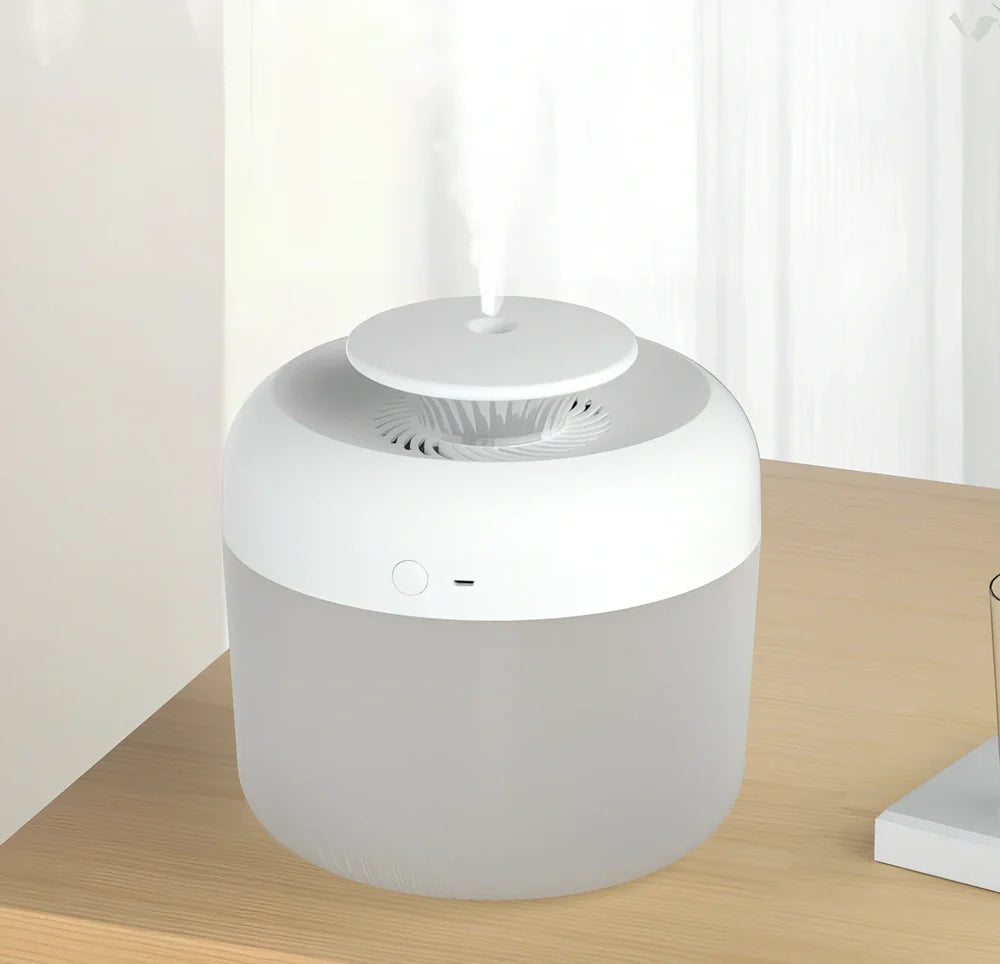 Round white ultrasonic humidifier with LED lights and water mist emitting from top