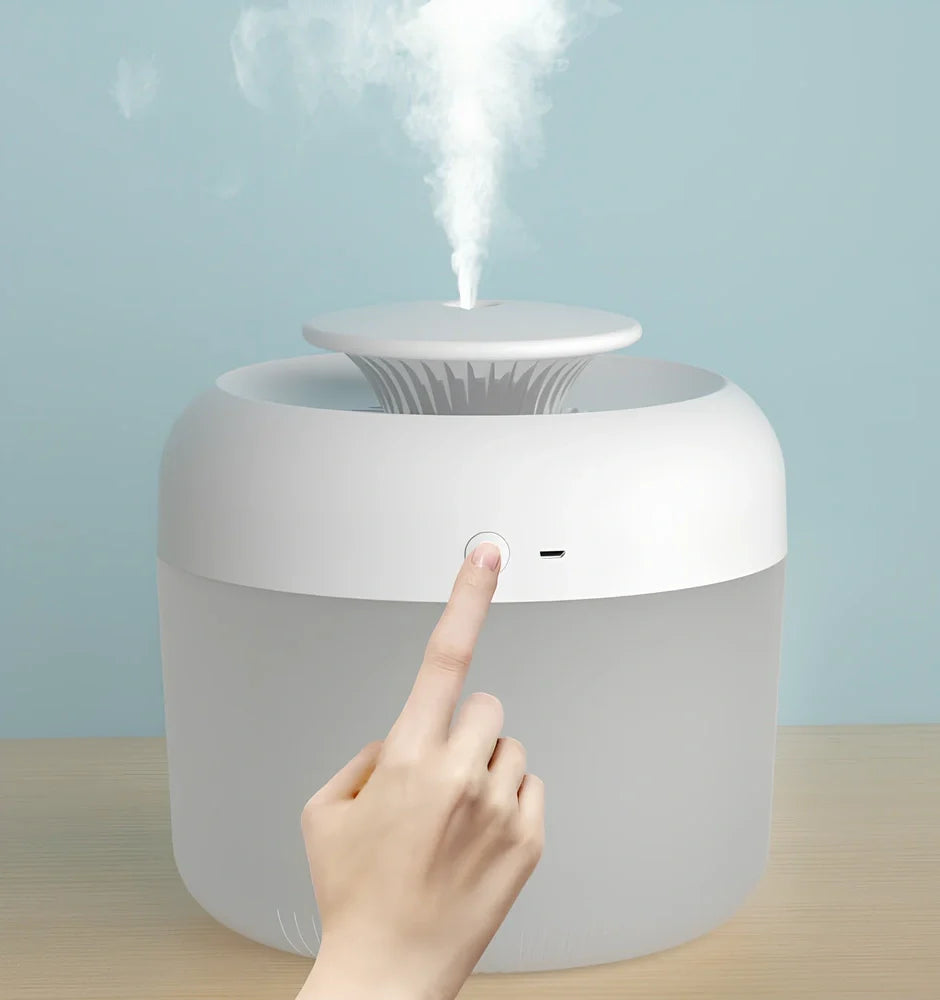 Round white ultrasonic humidifier with LED lights and water mist emitting from top