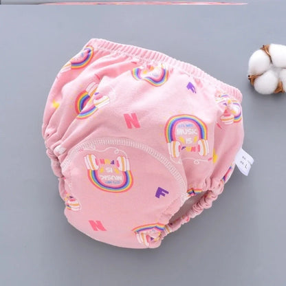 Baby diaper pants in dark blue, light blue, and pink, showcasing breathable cotton fabric and waterproof technology