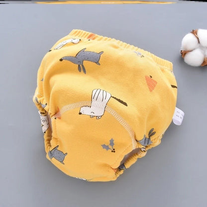 Baby diaper pants in dark blue, light blue, and pink, showcasing breathable cotton fabric and waterproof technology