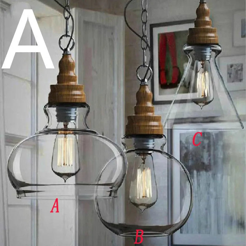 Glass single head pendant light with wood grain finish and adjustable cord.