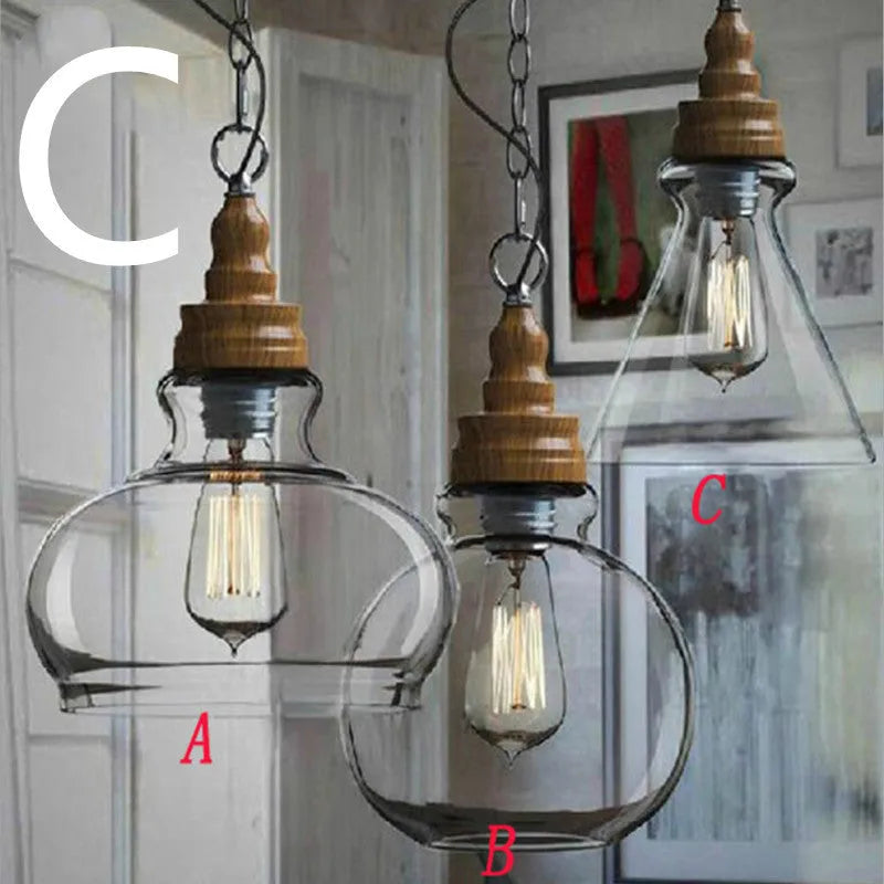 Glass single head pendant light with wood grain finish and adjustable cord.