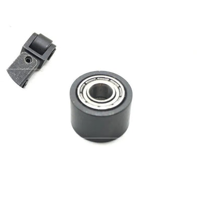 Metal pneumatic belt machine accessory kit with 330mm and 520mm rollers, blades, springs, and couplings on a workbench.