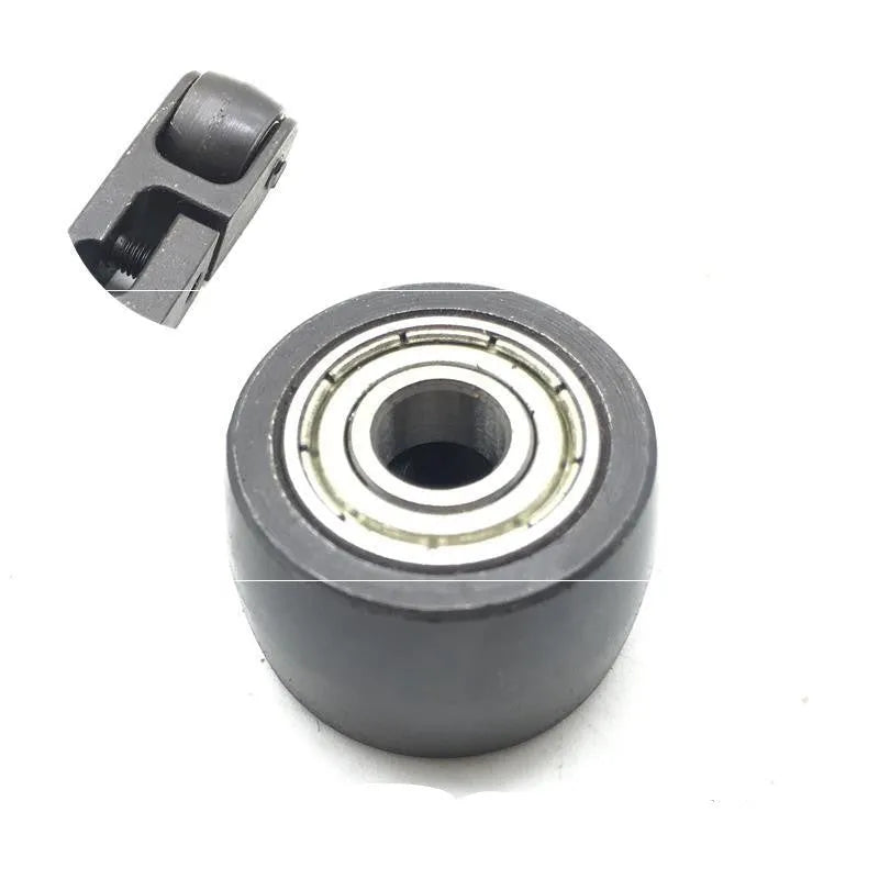 Metal pneumatic belt machine accessory kit with 330mm and 520mm rollers, blades, springs, and couplings on a workbench.