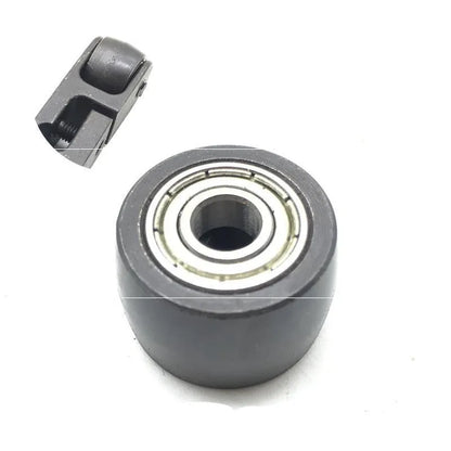 Metal pneumatic belt machine accessory kit with 330mm and 520mm rollers, blades, springs, and couplings on a workbench.