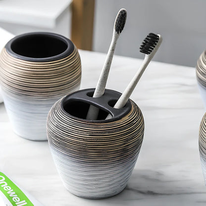 Retro brushed ceramic bathroom set with soap dish, toothbrush holder, and tumbler on vanity