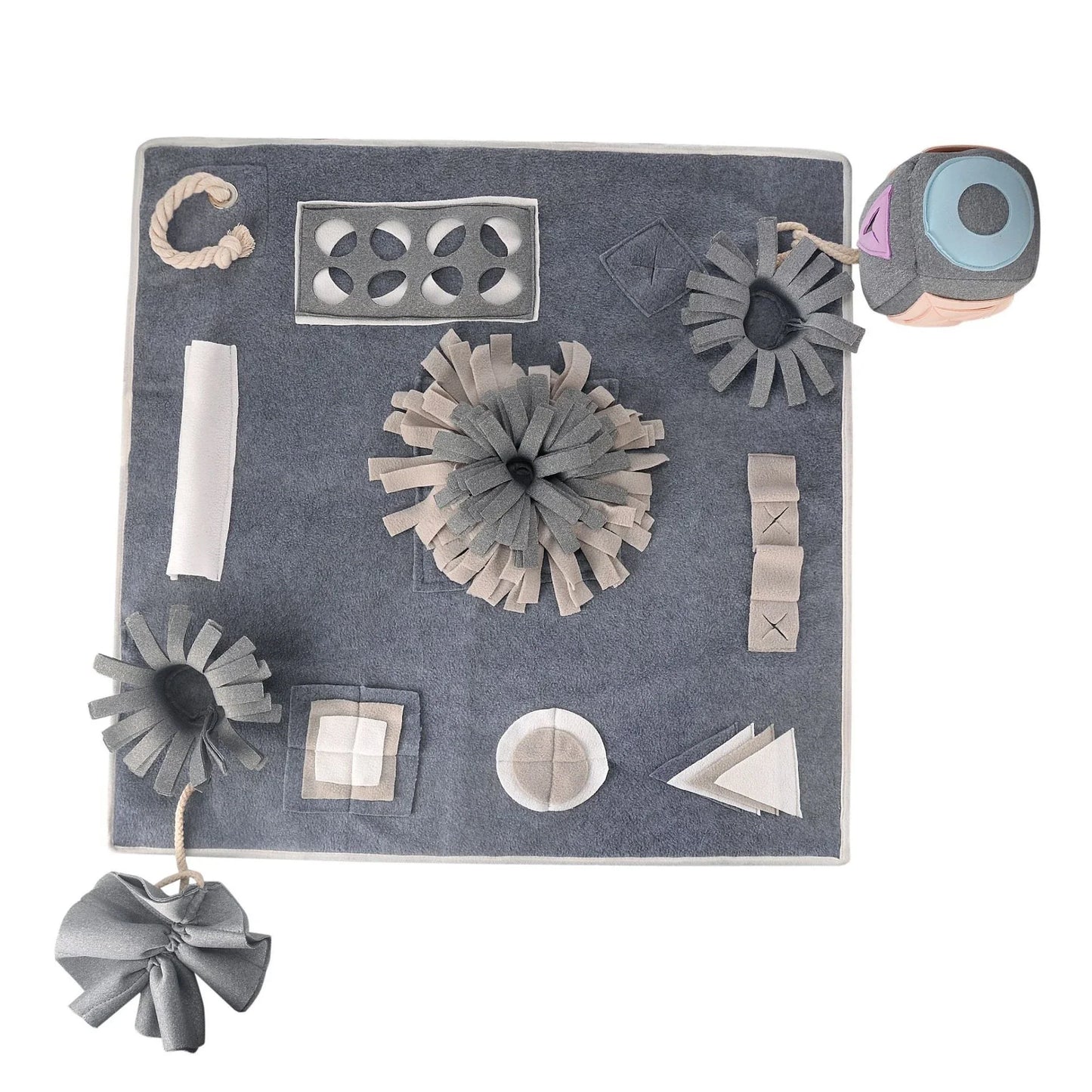 A grey snuffle pad with a soft, plush surface for hiding treats to stimulate a pet's natural foraging skills.