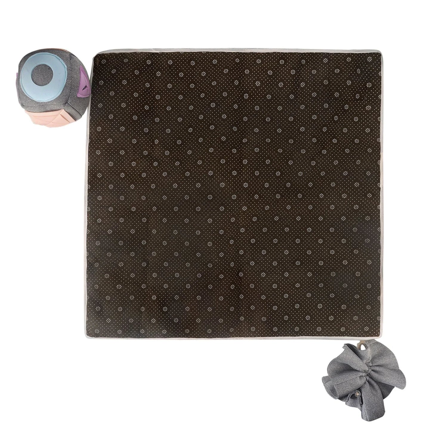 A grey snuffle pad with a soft, plush surface for hiding treats to stimulate a pet's natural foraging skills.