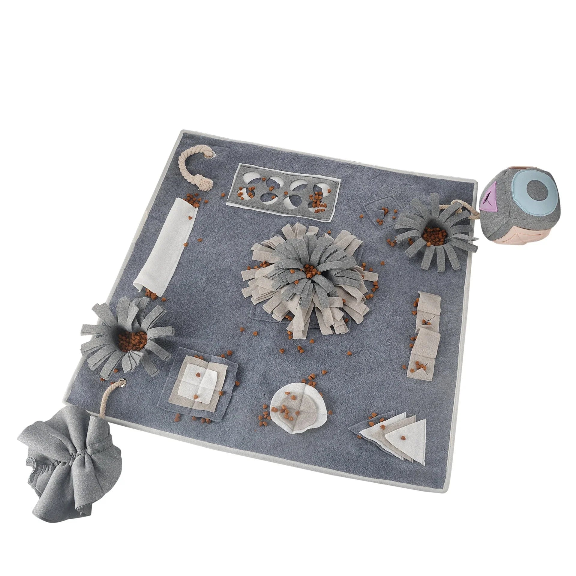 A grey snuffle pad with a soft, plush surface for hiding treats to stimulate a pet's natural foraging skills.